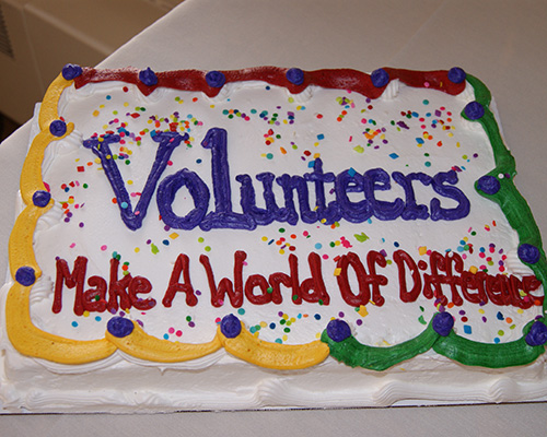 Sheet cake that says Volunteers Make A World Of Difference
