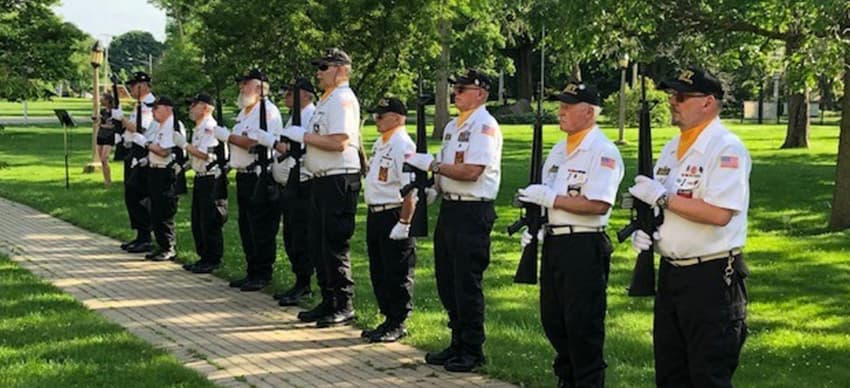 Color Guard members lined up holding rifles