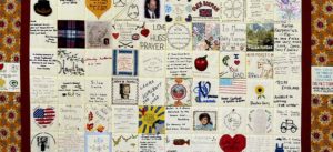 Large quilt with each square a different dedication or well wishes to hospice patients